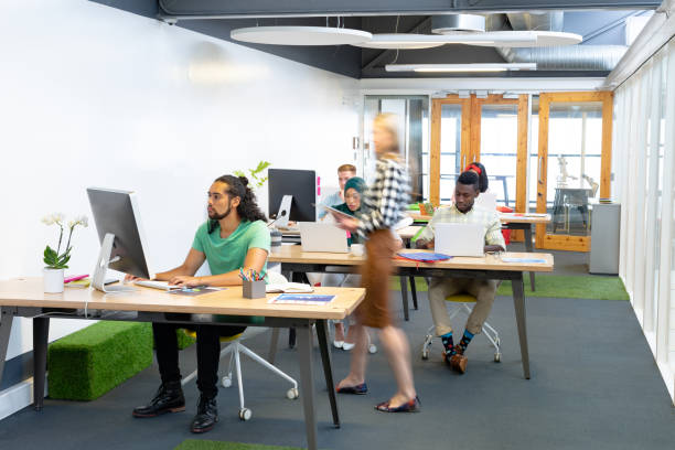 istock Business people working at desk in a modern office 1155693343