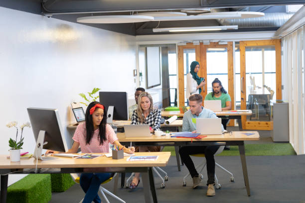 istock Business people working at desk in a modern office 1155695240