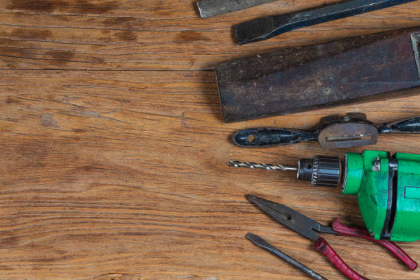 istock Collection of vintage woodworking tools on a rough workbench and blank copy space: carpentry, craftsmanship and handwork concept, 1155696369