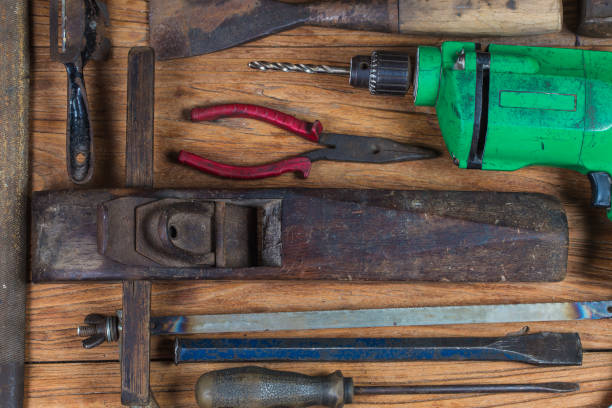 istock Collection of vintage woodworking tools on a rough workbench and blank copy space: carpentry, craftsmanship and handwork concept, 1155697913