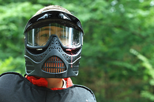 Paintball player with mask after being hit in the head