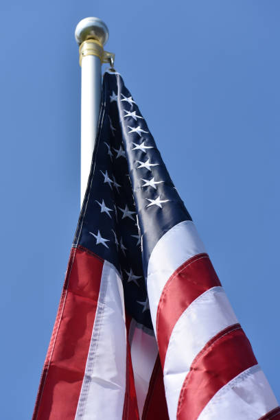 istock USA flag on flag pole 1155702034