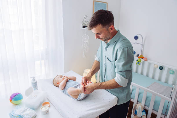 istock Changing diaper to baby son 1155705727