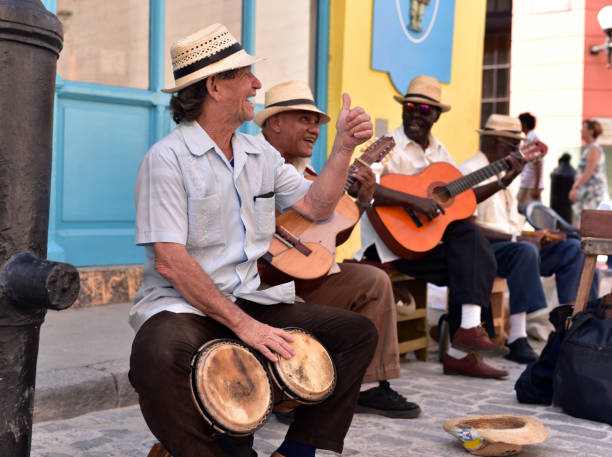 Cuban band in Havana Cuban band of street musicians play in a public square in Old Havana, Cuba salsa music photos stock pictures, royalty-free photos & images