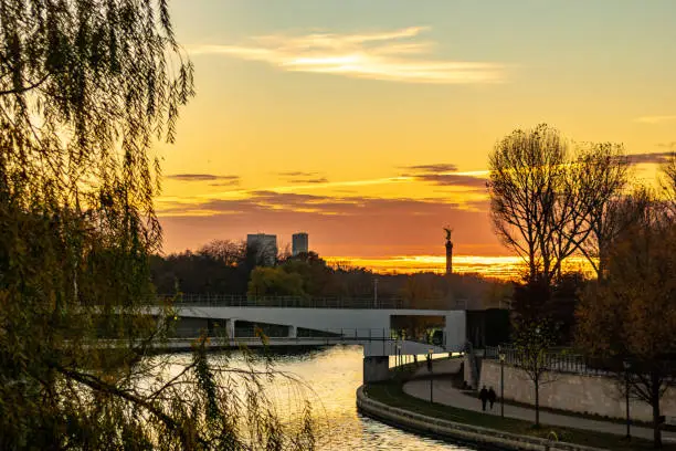sunset over the spree river in Berlin with the victory column in the background and the private bridge to the chancellors office