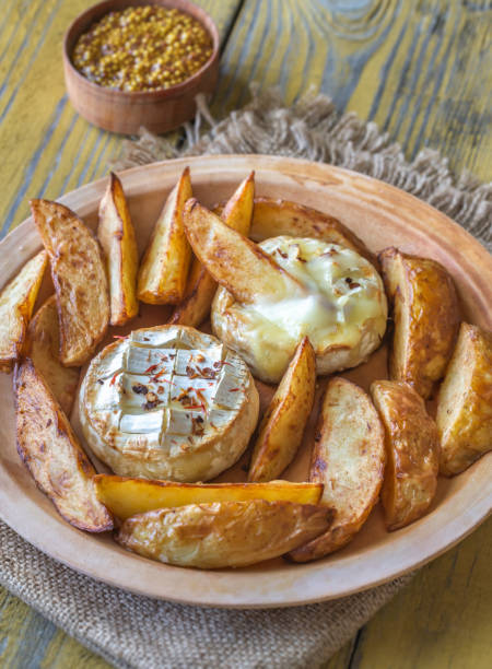 istock Baked Camembert cheese with potato 1155709000