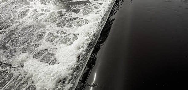 istock Top part of dam with the falling water. 1155711992