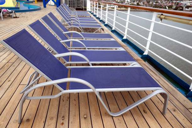 istock Deck Chairs Arranged Neatly In Rows With A Beautiful Sunny Blue Sky With Puffy Clouds To Enjoy 1155712133