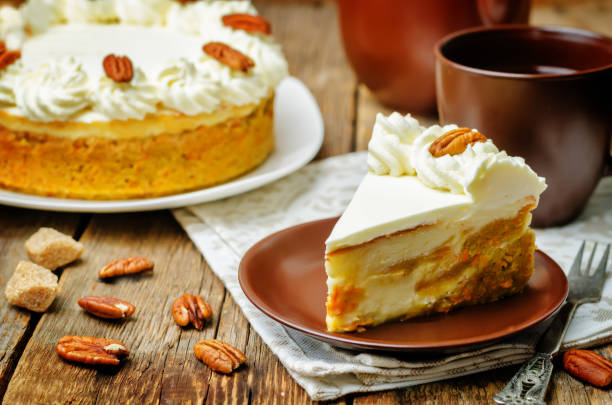 istock carrot cake cheesecake with pecan on a wood background 1155717721