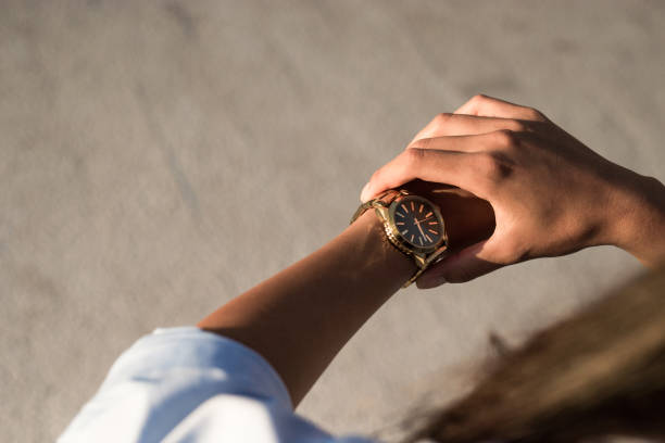 istock Young elegant woman checking time. 1155718530