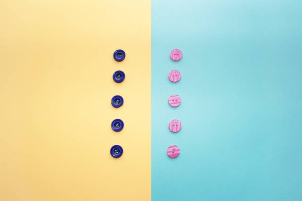 istock collection of various multicolored sewing button on blue background. Yellow, purple, dark blue buttons. Minimalism. Sewing accessories. Flatlay, place for text 1155719235