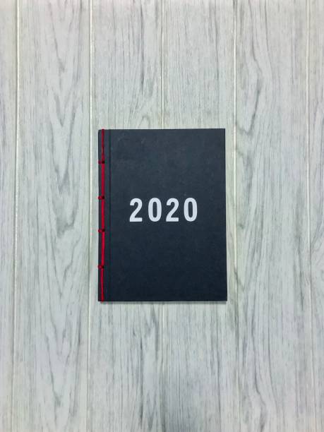 istock Vintage book with 2020 written 1155720617