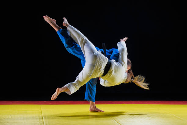 istock Judoka throwing sparring partner to the ground 1155720796