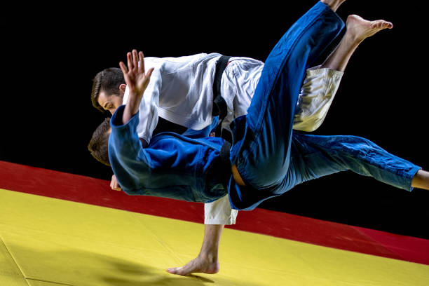 istock Judoka throwing sparring partner to the ground 1155720802