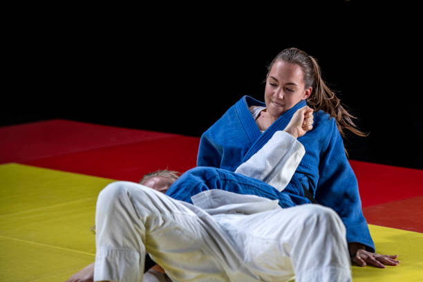 istock Two female judo practitioners practicing on a tatami mat 1155720822