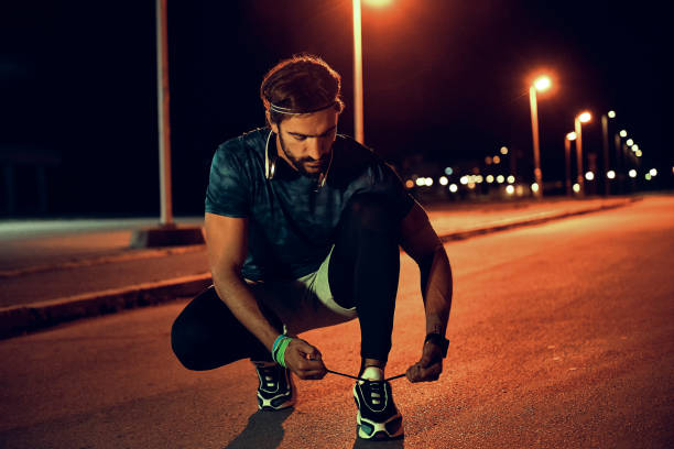 istock man tying his shoes and getting ready for training 1155722223