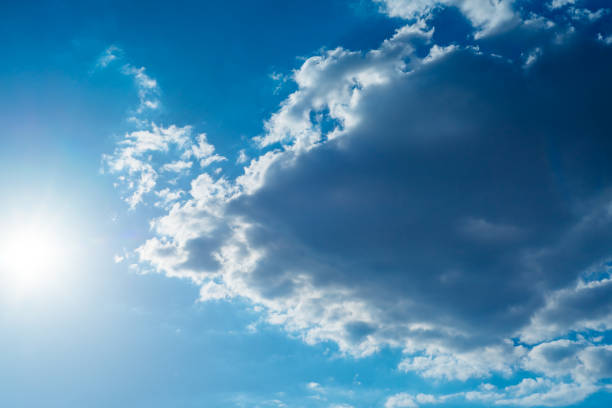 istock The sun shines bright in summer. Blue sky and clouds. 1155722276