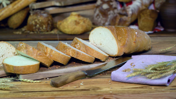 istock Sliced white bread on the table in the bakery close-up. 1155722822