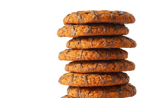 Lots of chocolate cookies isolated on white background.
