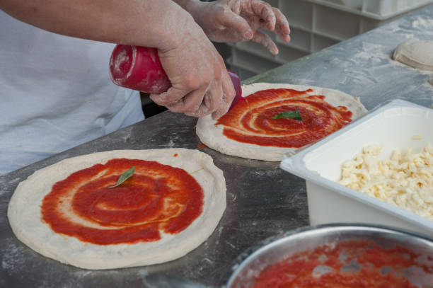 istock Preparing Pizza dought at the pizzeria. 1155724580