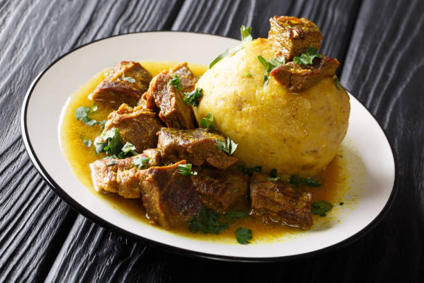 traditional mofongo with plantains, garlic and chicharron served with meat and broth close-up on a plate. horizontal - main course imagens e fotografias de stock