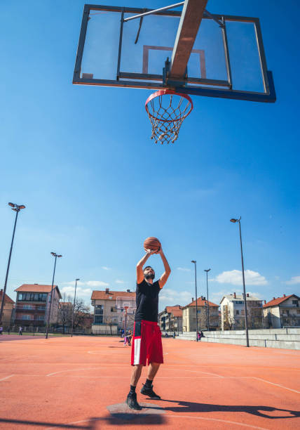 istock Basketball player jumping to score 1155728333