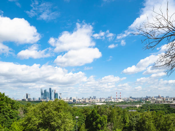 istock white cimulus clouds in blue sky over Moscow city 1155730786