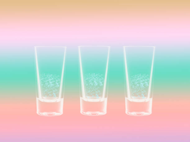 istock Three glasses on a gently pink and green background 1155732800