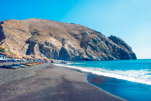 istock Sandy Beach Ready For Tourists In Santorini, Greece 1155735174