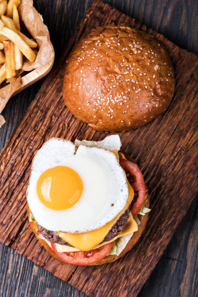 istock Burger on a wooden board 1155735766