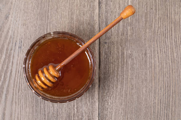 istock Honey in a transparent jar 1155735774
