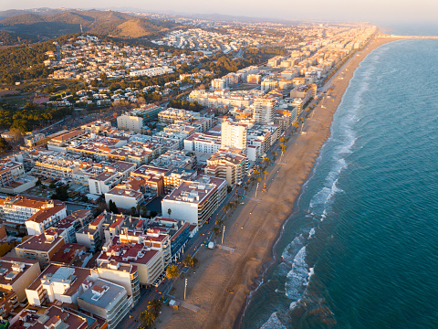Panoramic aerial view of Spanish coastal town of Calafell in sunny day, Catalonia