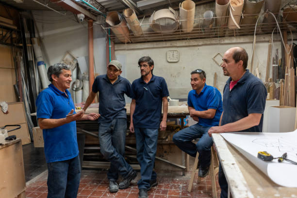istock Group of carpenters in a meeting 1155739100