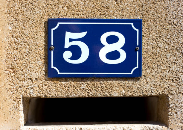 istock France: Number 58 Street Address Plaque (Close-Up) 1155741490