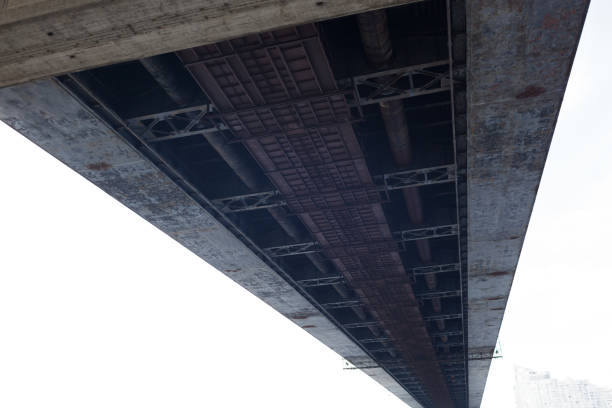 Panoramic perspective of a highway bridge with surrounding landscape and traffic.