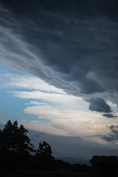 istock Dramatic morning sky with dark and white clouds 1155741534