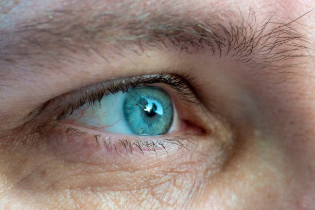 istock Close-up of a males blue eye 1155742410