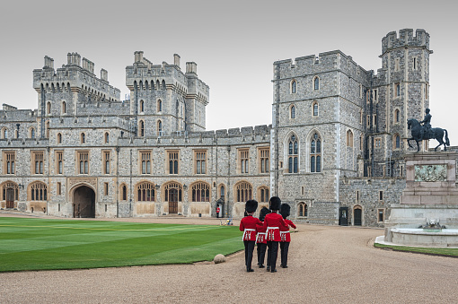 WINDSOR, ENGLAND -MAY, 24 2018: Changing of the guards at Windsor Castle, the residence of the British Royal Family at Windsor in the English county of Berkshire, United Kingdom