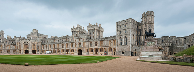 WINDSOR, ENGLAND -MAY, 24 2018: Windsor Castle, built in the 11th Century, is   the residence of the British Royal Family at Windsor in the English county of Berkshire, United Kingdom