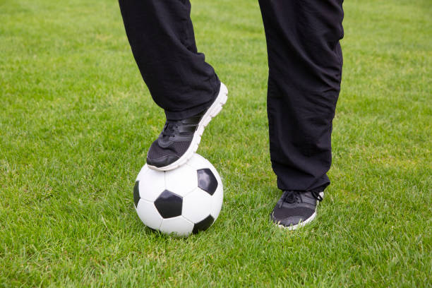 istock Legs with soccer ball 1155743557