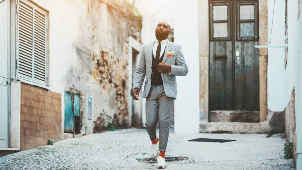 istock An Afro guy walking down the street 1155747825