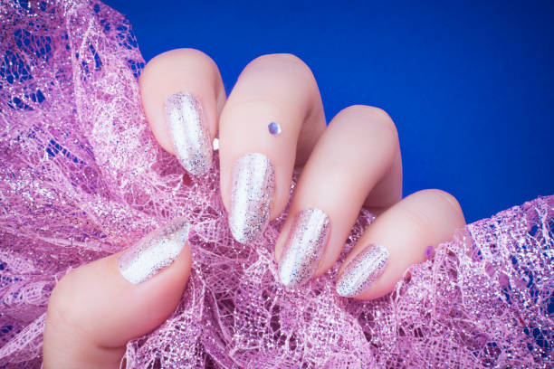 istock glittered purple nails manicure 1155749216