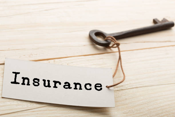istock home insurance concept - old key with tag 1155750572