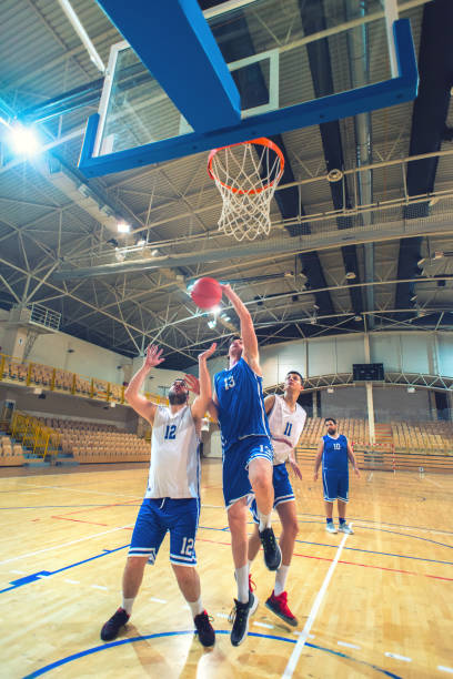 istock Basketball players playing basketball 1155756511
