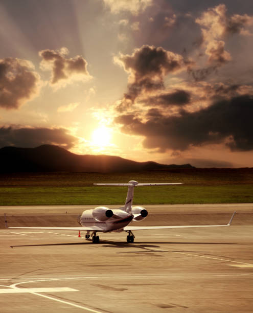 istock private jet airplane parked at airport over cloudy sunset sky 1155756976