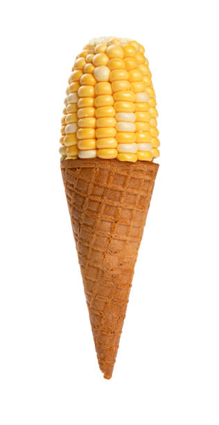 ice cream cone with a piece of fresh maize on white background with clipping path