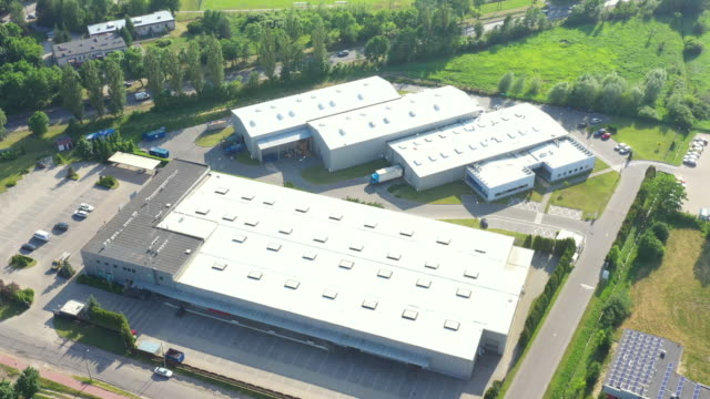 Distribution warehouse with trucks of different capacity. Aerial View
