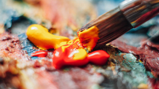 istock artist mixing acrylic paint colorful palette 1155772328