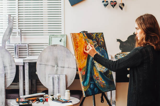 istock painting process artist creating abstract painting 1155772334