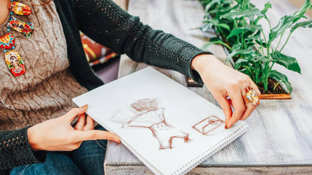 istock hobby talent lefthanded fashion designer drawing 1155772336